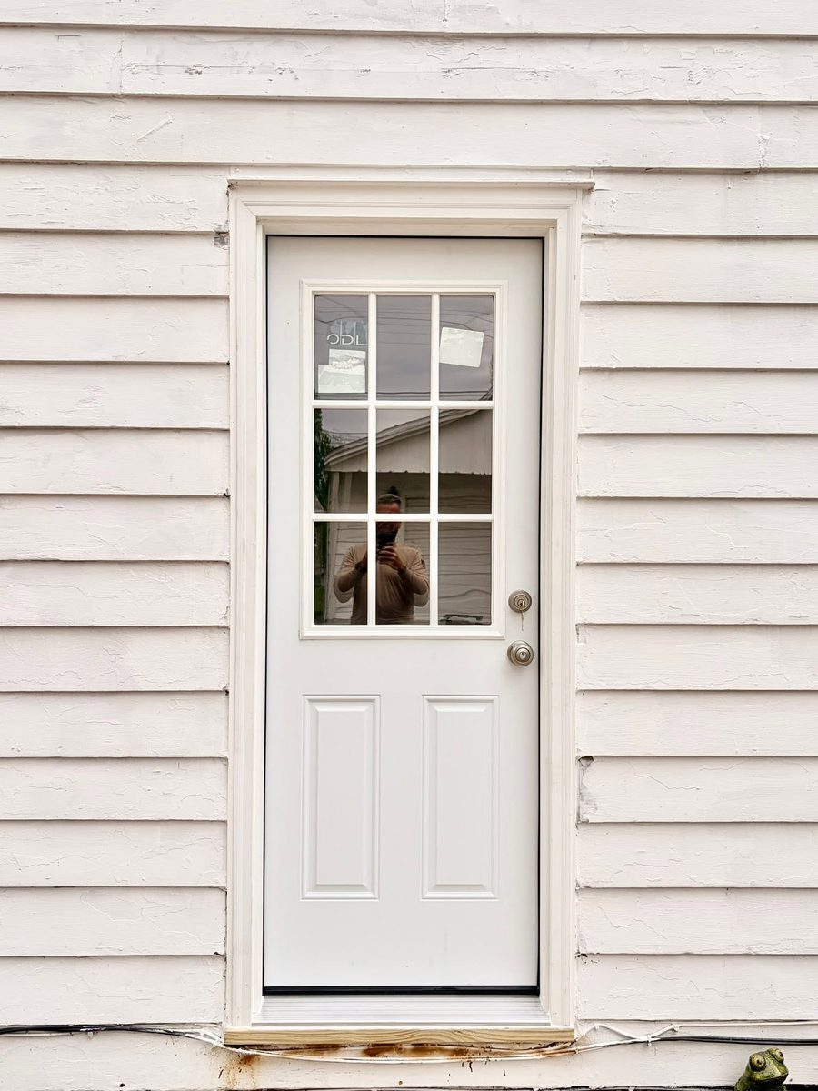 New nine-lite back door with fresh casing and threshold
