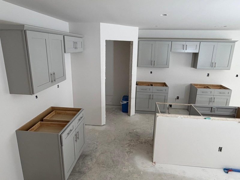 Kitchen cabinets set and levelled with drawer boxes open