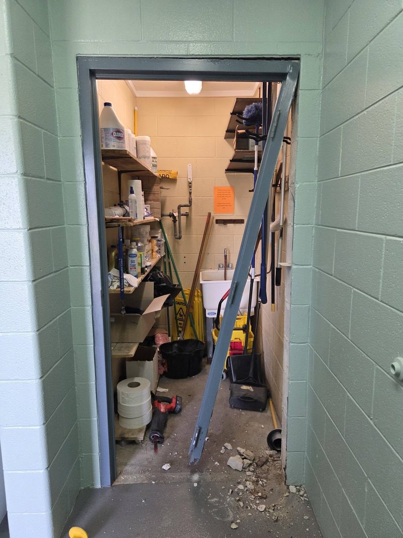 Old steel door frame pulled out of a block opening during a replacement