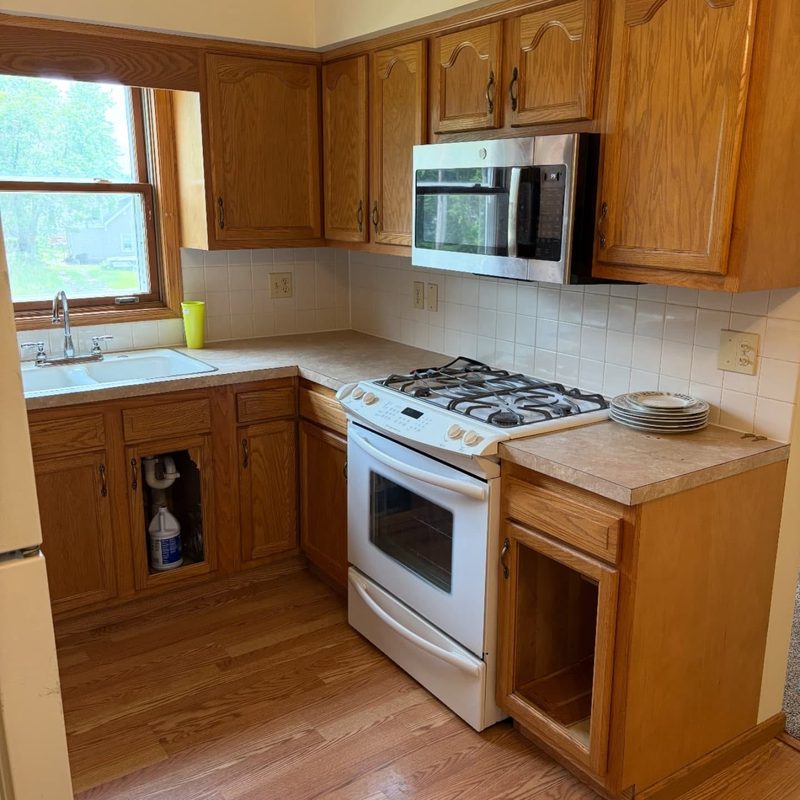 Oak kitchen cabinets with two doors removed